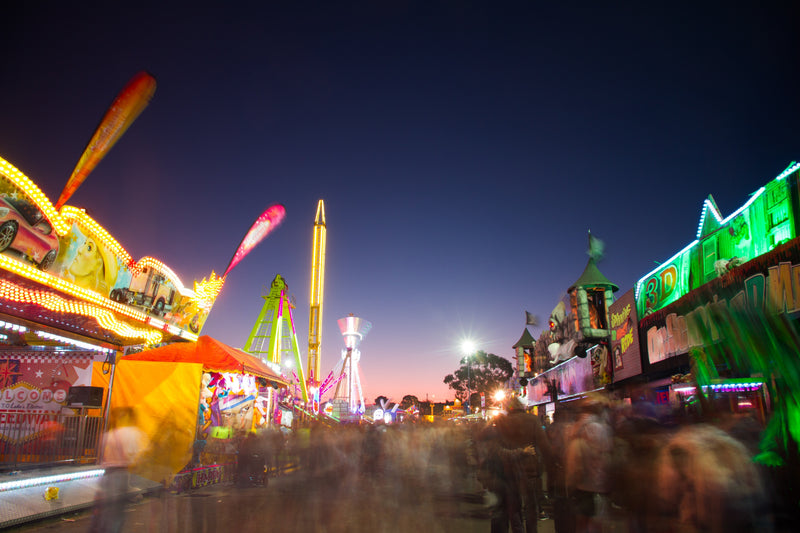 games at a county fair at night