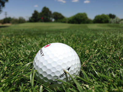 golf ball on beautiful green field