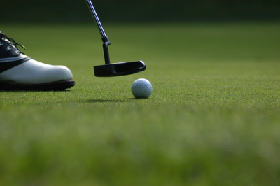 Golfer on putting green
