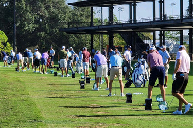 Multiple GCQuad Launch Monitors Lined up at golfing range