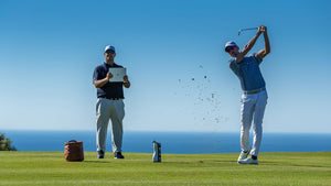 Professional Golfer using launch monitor outdoors