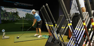 Professional Golf Player Using Indoor Golf Simulator