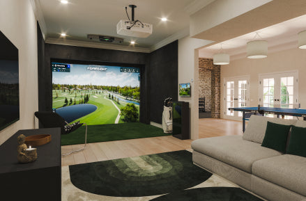 A living room with an indoor golf launch simulator